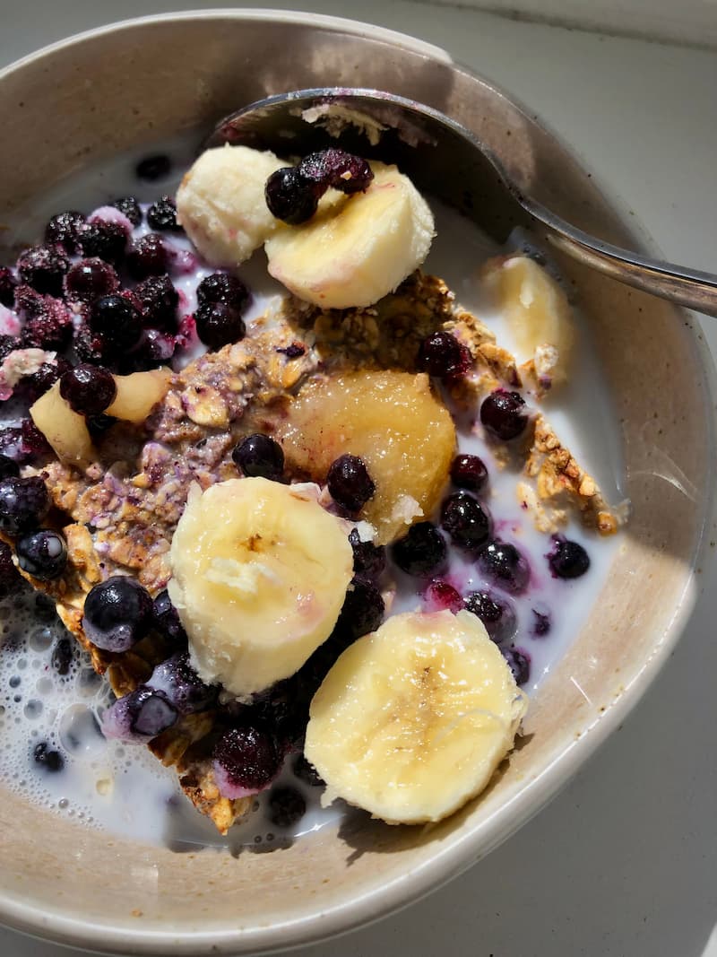 oat breakfast bread pudding with blueberries and banana